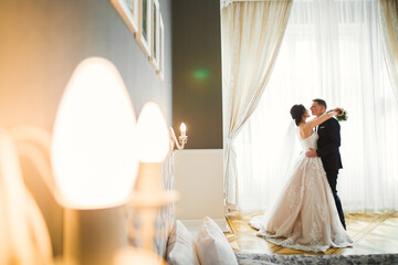 Romantic wedding moment, couple of newlyweds smiling portrait, bride and groom hugging