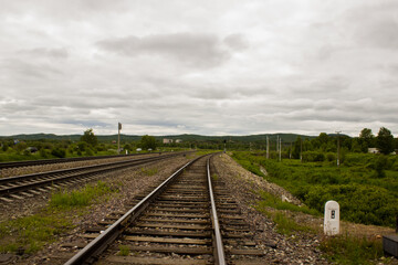 Fototapeta na wymiar landscape with railway tracks. nature and the railway. summer landscape.