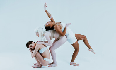 Fototapeta premium Group of multiethnic women with different kind of skin posing together in studio. Concept about body positivity and self acceptance
