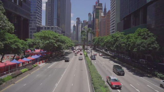 Establishing shot of Asian city with traffic going both ways from high angle