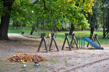 Empty shabby wooden municipal playground with no children