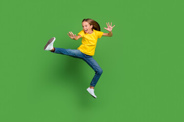 Fototapeta na wymiar Full length body size view of attractive cheerful crazy girl jumping fooling dancing isolated over bright green color background