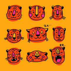 Fototapeta premium Vector illustration with tigers heads isolated on colored background. Cartoon