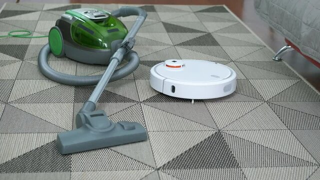 Robot hoover tool. A robot hoover move on the rug and clean it drom dust.