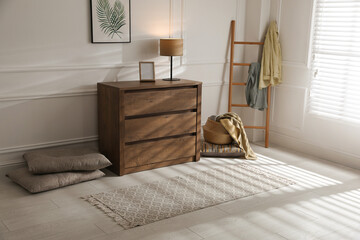 Stylish rug with pattern on floor in room