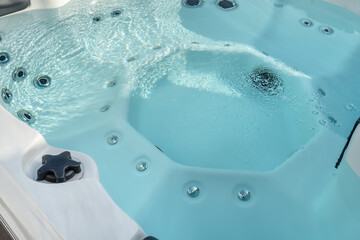 Luxury bathtub, jacuzzi for therapeutic massage and relaxation close-up. - obrazy, fototapety, plakaty