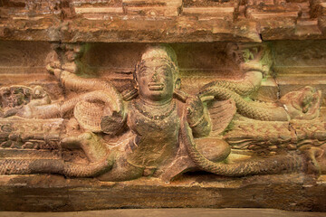 Sculpture of Garuda holding Nagas on door top at Ladkhan Temple in Aihole, Bagalkot district