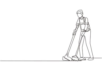 Single continuous line drawing housekeeping male worker with broom and dustpan. Young man janitor, sweeping the floor with broom, holding dustpan, professional cleaning. One line draw design vector