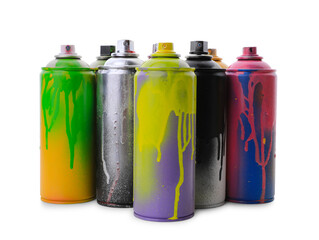 Used cans of spray paints on white background. Graffiti supplies