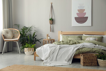 Obraz premium Stylish room interior with comfortable wooden bed