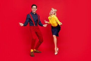 Photo of funky handsome young guy lady wear pin up clothes smiling dancing swing beating fingers...