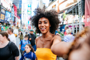 Young beautiful girl walking in Time square, manhattan. Lifestyle concepts about New york - obrazy, fototapety, plakaty
