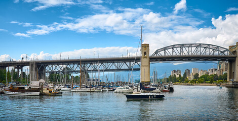 Naklejka premium Vancouver Cityscape. Yachts at False Creek on a summer sunny day. British Columbia, Canada