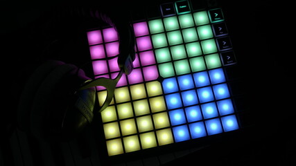 Launchpad Light Colorful with Headphones in Dark Studio