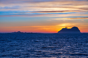 Fototapeta premium Awesome sunset at rock in the sea