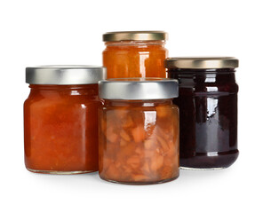 Jars with different jams on white background