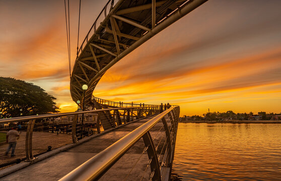 the S -shaped bridge at dusk which is the bridge of pride of the state of sarawak and tourism
