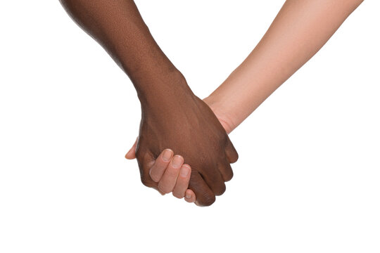 Woman and African American man holding hands on white background, closeup