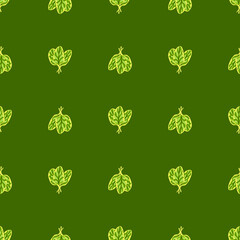 Seamless pattern bunch spinach salad on green background. Minimalistic ornament with lettuce.