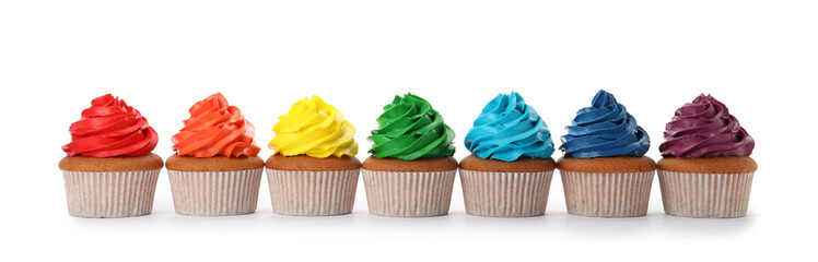 Different delicious colorful cupcakes on white background