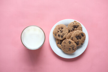 chocolate cooking and a glass of chocolate milkshake on pink 