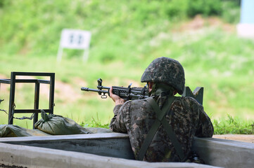 A South Korean soldier shooting at a military shooting range.