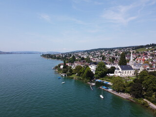 Fototapeta na wymiar White church at Lakeside Switzerland