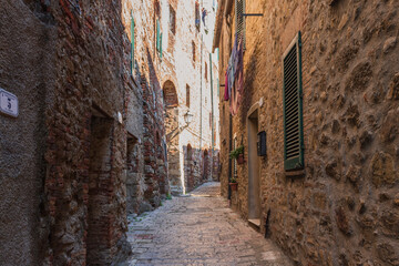 Fototapeta na wymiar View of narrow street in Chiusdino, Tuscany, Italy. Copy space.