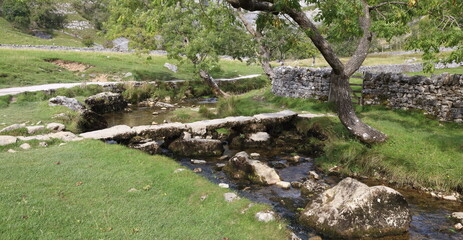 Ancient stone Bridge over small Stream.