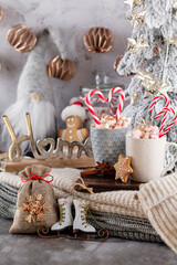 Gingerbread with mug of hot chocolate and candy cane.