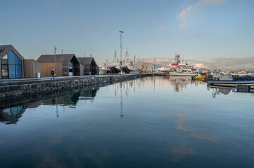 Boats and buildings reflected in the harbor at Reykjavik, Iceland