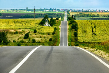 Empty asphalt road motorway in the hilly countryside in Ukraine