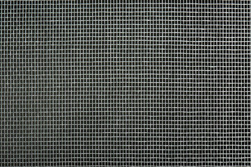 Closeup view of mosquito window screen on grey background