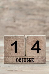 cube calendar for october on wooden background with copy space