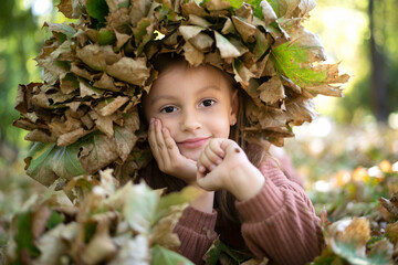 Girl is holding a ladybug one sunny autumn day  © nellas