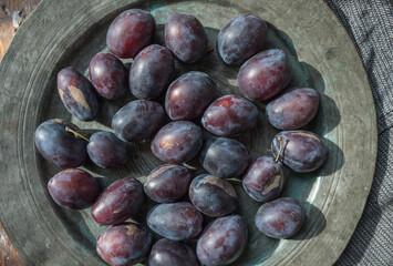 fresh plums on a plate