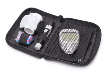 Diabetes blood glucose monitor test kit on white