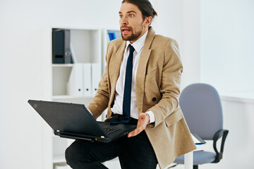 man in beige jacket official laptop work office executive