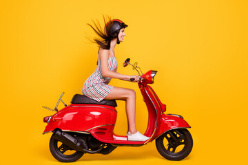 Fototapeta na wymiar Full length body size side photo woman riding bike wearing dress helmet isolated bright yellow color background