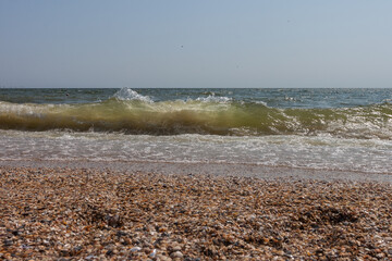 Big and stormy waves of the Black Sea on a sunny day. Small depth of field. Sea view