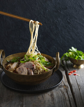Pork Hock and Trotter served with noodles, with chop sticks