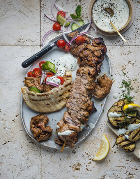 Pork Neck Skepasti served with pitta bread