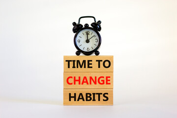 Time to change habits symbol. Concept words 'time to change habits' on wooden blocks. Beautiful white background. Black alarm clock. Copy space. Business and time to change habits concept.