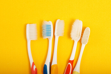 Techniques for storing toothbrushes and cleaning brushes after use to reduce the accumulation of germs and bacteria