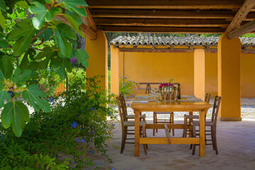 Obraz premium dining table in a mediterranean garden