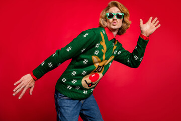 Photo of flirty sweet young guy dressed print pullover glasses dancing lips pouted plump isolated red color background