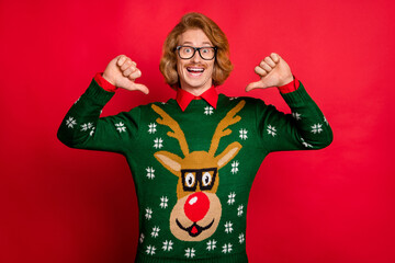 Photo of shiny excited young man wear green sweater spectacles smiling pointing thumbs himself...