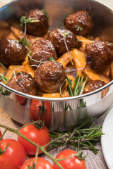 Stewed meatballs in cheese sauce