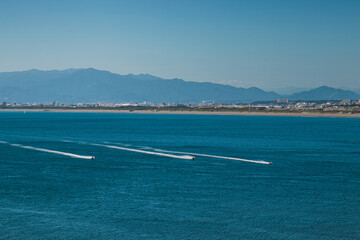 Romantic seascape photo of Japan beach in kannagawa, Enoshima area during golden time and sunset period which be able to see Fuji mountain from here. It's very famous recreational place in summer.