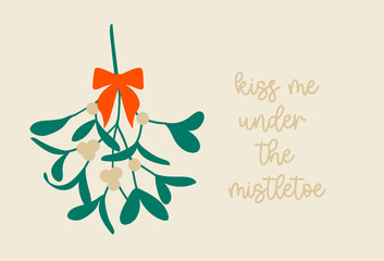 Christmas mistletoe with a bow and a quote Kiss me under the Mistletoe. Hanging  green plant with berries as a traditional symbol for Christmas. Vector drawing in a simple cartoon style. Isolated